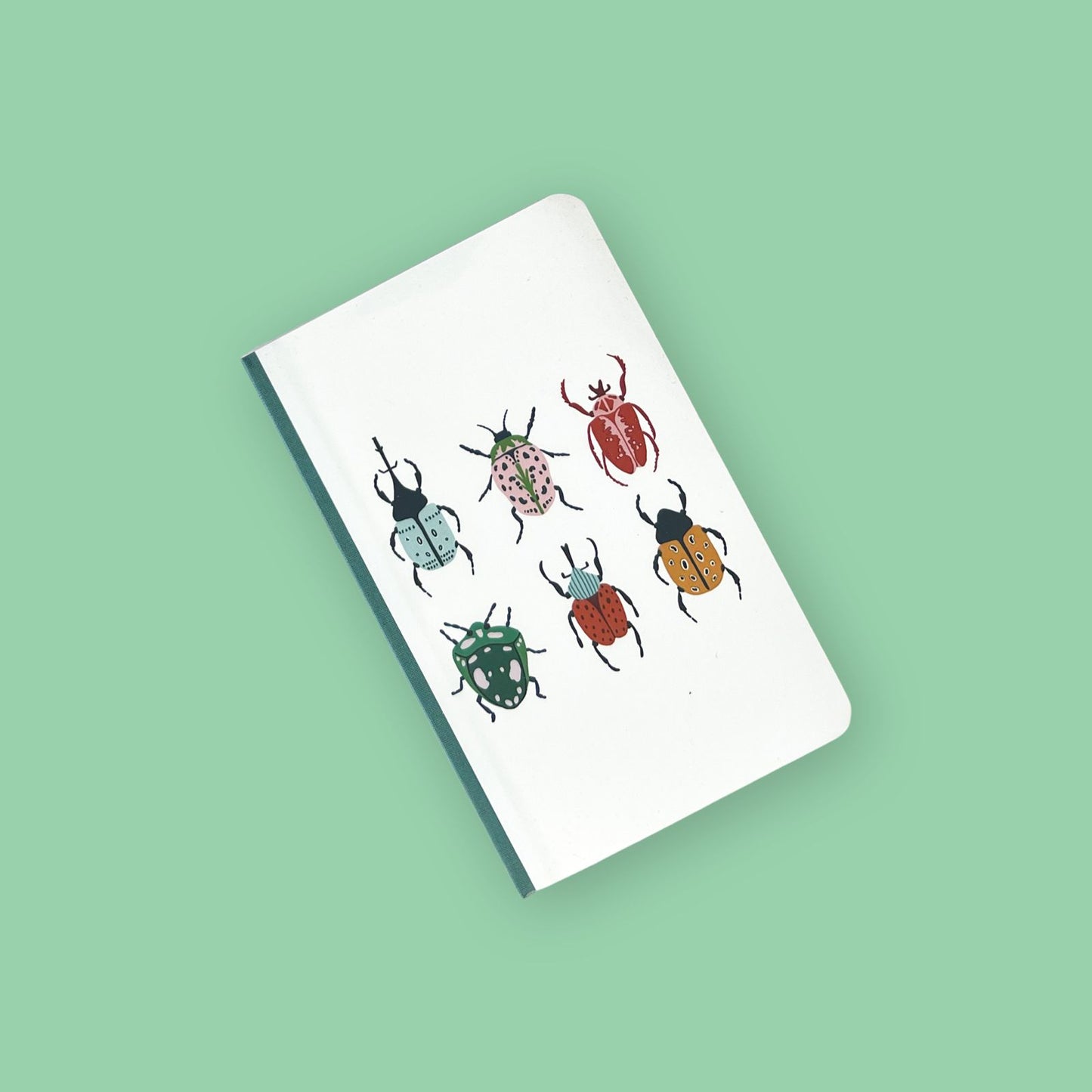Libreta con dibujo de bichos de colores