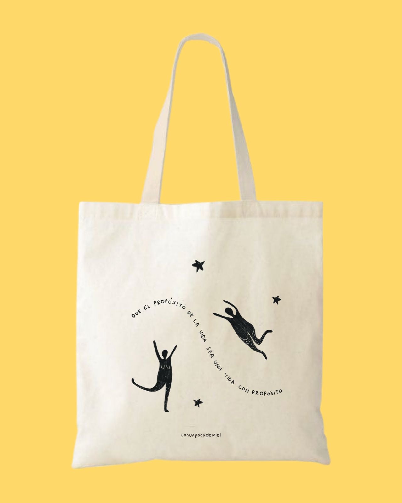 Foto de totebag con dibujo de que el propósito de la vida sea una vida con propósito con fondo amarillo